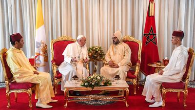 Pope Francis is received by King Mohammed VI, his son Crown Prince Moulay Hassan, right, and brother Moulay Rachid upon his arrival in Rabat. AFP