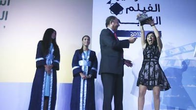 A delighted Sara Saber, right, shows her pleasure at picking up four awards, including Best Film, at the Arab Film Studio Awards last night at the Viceroy Hotel on Yas Island in Abu Dhabi. Lee Hoagland / The National
