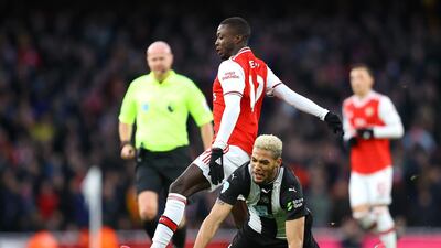 Joelinton is challenged by Nicolas Pepe of Arsenal during the Premier League match at the Emirates Stadium in February. Getty