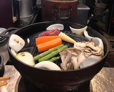 Make a beeline for Sapporo Genghis Khan in Susukino, where you'll grill your own meat and veggies with the locals. Courtesy Declan McVeigh