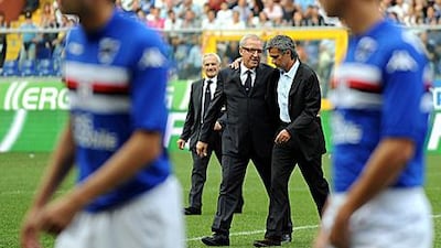 Jose Mourinho puts an arm around Gigi del Neri's shoulder before a match last year.