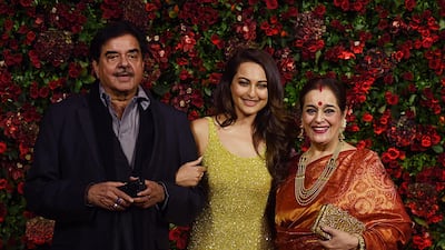 Shatrughan Sinha, Sonakshi Sinha and Poonam Sinha. AFP