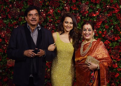 Sonakshi Sinha with her father Shatrughan Sinha and mother Poonam Sinha. AFP