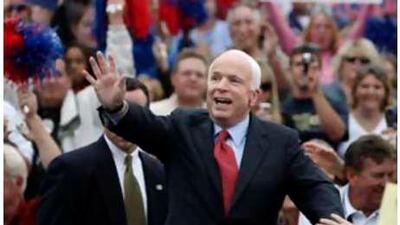 The US Republican presidential nominee Senator John McCain greets supporters as he arrives at a rally in Belton, Missouri on Oct 20 2008.