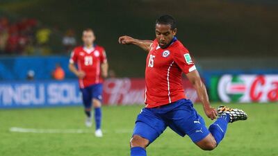 Jean Beausejour of Chile shoots and scores their third goal in the 3-1 win over Australia on Friday at the 2014 World Cup in Cuiaba, Brazil. Clive Brunskill / Getty Images