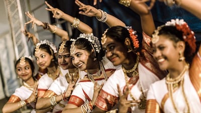 A group of colourful classical dancers from the Kumari Shiksha Dance Institution pose backstage before taking part during the two day Diwali (Festival of Lights) Hindu festival celebrations at the old Drive-Inn in Durban, on October 19, 2019. AFP