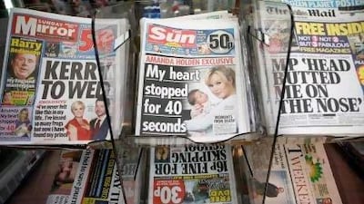 The Sun on Sunday appears on a news-stand in London. Critics say the first edition was 'bland' compared to the News Corp publication it has replaced, the News of the World.