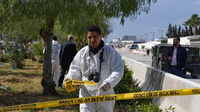 A forensic expert seals off the scene of an explosion near the US embassy in Tunis. AFP