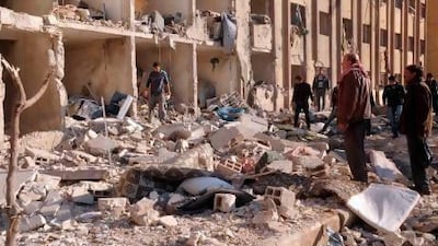 Syrians gather at the scene of an explosion outside Aleppo University, between the university dormitories and the architecture faculty.