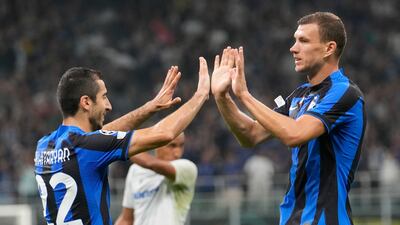 Edin Dzeko, right, celebrates with Henrikh Mkhitaryan after scoring Inter's third goal. AP