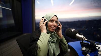 Iman Khatib Yasin, the first Muslim lawmaker in Israel's history to wear a head scarf, following results of her Arab Joint List party in Israel's election, participates in an interview in a radio show in Nazareth, Israel on March 5, 2020. Reuters