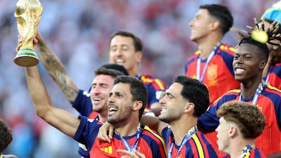 Spain's Rodri lifts the Fifa World Cup trophy after victory over Argentina in the final at the New York-New Jersey Stadium. AFP