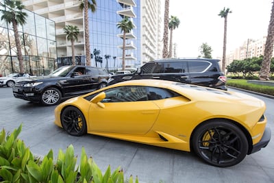 The Lamborghini parked outside a five star hotel on the Palm. Leslie Pableo for The National