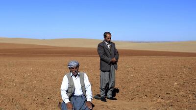 Men pray while facing the Syrian town of Kobani near the Mursitpinar border crossing, on the Turkish-Syrian border in Suruc, Sanliurfa province, Turkey. Turkey announced that they will allow Iraqi Kurdish forces to cross its territory to reinforce the Syrian Kurdish militia in the besieged city of Kobani. Gokhan Sahin / Getty Images