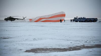 A search and rescue team works on the site of landing of the Soyuz MS-06 space capsule with International Space Station crew members Joe Acaba and Mark Vande Hei of the US, and Alexander Misurkin of Russia in a remote area outside the town of Dzhezkazgan (Zhezkazgan), Kazakhstan. Alexander Nemenov / Reuters