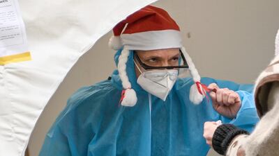 Medical personnel register a patient for a coronavirus test in Berlin, Germany. AP Photo