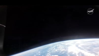 Earth as seen from the Orion spacecraft 'Integrity' during its re-entry to the atmosphere. EPA