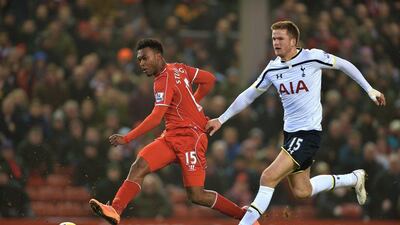 Daniel Sturridge, left, in action against Tottenham, is vital to Liverpool's hopes of a top-four finish. Peter Powell / EPA