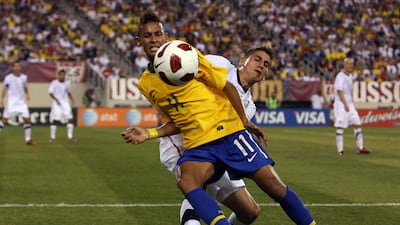 An 18-year-old Neymar, left, tussles with USA's Alejandro Bedoya on his international debut in July 2010 in East Rutherford, New Jersey. Getty