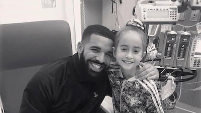 Drake poses with Sofia Sanchez, at Lurie Children's Hospital in Chicago. OVO/Drake via AP