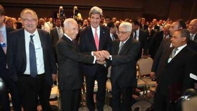 Mahmoud Abbas, president of the Palestinian Authority, and the US Secretary of State Senator John Kerry at the conference. Salah Malkawi for The National