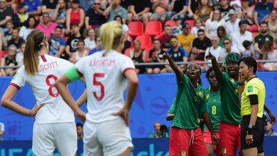Players of Cameroon speak with referee Qin Liang during the 2019 FIFA Women's World Cup France Round Of 16 match between England and Cameroon at Stade du Hainaut Valenciennes, France. Getty Images