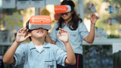 Pupils at a Taaleem school using virtual reality headsets to help them learn. Photo: Taaleem