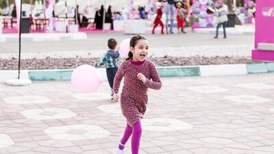 A little girl plays at Zayed Sports City in Abu Dhabi, where the Pink Caravan Ride 2017 held its closing event on March 17, 2017. Reem Mohammed / The National