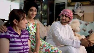 Lujain Hussein, centre, was beaten on the school playground. Her mother Maha, left, and her brother Mahran, right, didn't know she was being bullied. Silvia Razgova / The National