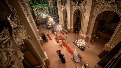Lithuanian Orthodox priests attend in the Orthodox Christmas celebration Mass in the empty Orthodox Church of the Holy Spirit in Vilnius, Lithuania. AP Photo