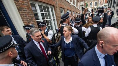 Labour Party leader Keir Starmer passes protesters after leaving Chatham House, where he delivered a speech on the situation in the Middle East. Getty Images