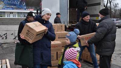 Internally displaced civilians receive humanitarian aid distributed in Zaporizhzhia on February 6, 2024, amid the Russian invasion of Ukraine. AFP