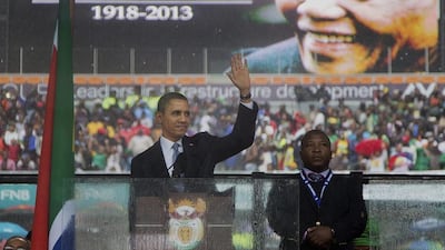 US President Barack Obama arrives to speak at the memorial service for Nelson Mandela at the FNB Stadium in Johannesburg. Evan Vucci / AP
