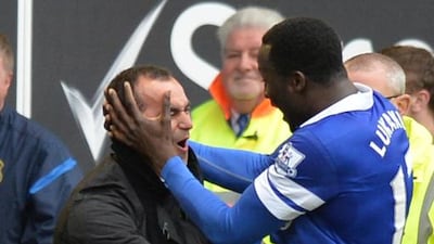Roberto Martinez, left, has been credited with a slight change in thinking at Everton, which has gone from playing an overly cautious brand of football at times under David Moyes to something more fun to watch. Paul Ellis / AFP