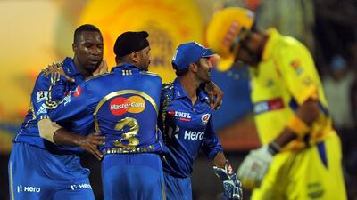 The rivalry between Mumbai Indians, in blue, and Chennai Super Kings, in yellow, could draw huge crowds from around the country. Manjunath Kiran / AFP
