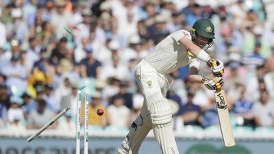 Australia's Marcus Harris is bowled by England bowler Stuart Broad. AP
