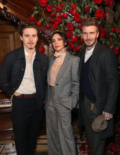 Brooklyn with his parents at London Fashion Week in 2019. WireImage