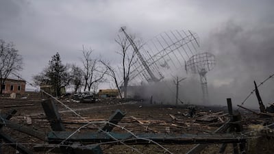 Smoke rise from an air defence base in the aftermath of an apparent Russian strike in Mariupol, Ukraine. AP