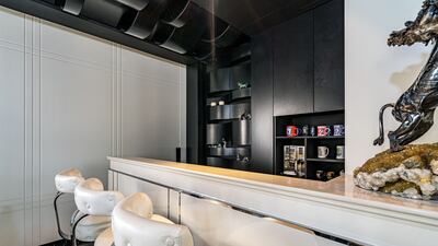 The first floor recreation room has a bar.