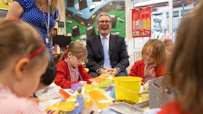 Prime Minister Keir Starmer speaks to reception class children at a primary school in Orpington, near London. Getty Images