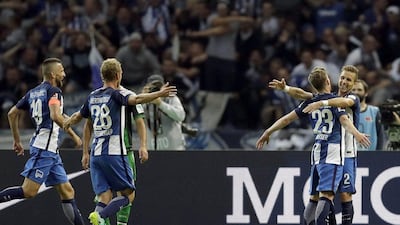 Hertha Berlin’s Mitchell Weiser, second right, and his teammates celebrate a goal in their Bundesliga win on Sunday. Michael Sohn / AP Photo