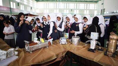 Students admire creations made with waste metal at the environmental art competition at the Emirates Heritage Club in Abu Dhabi.