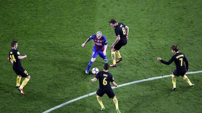 FC Barcelona’s Lionel Messi, centre, in action against Atletico Madrid. Alberto Estevez / EPA
