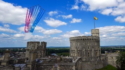 The Red Arrows conduct a flypast during a military ceremony to mark Britain's Queen Elizabeth II's official birthday at Windsor Castle. AFP
