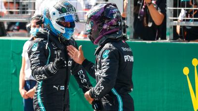 Mercedes' Lewis Hamilton congratulates teammate Valtteri Bottas after qualifying. AFP