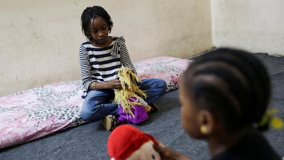 Sisters Talia and Talien, who fled with their family from their home in Sudan's capital Khartoum, at a shelter in Giza, Egypt. Reuters