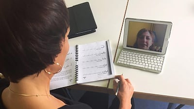 NaTakallam teacher Varty Komjian, seen in the iPad, gives an Arabic class from Yerevan, Armenia.