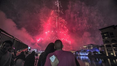 DUBAI, UNITED ARAB EMIRATES - JANUARY 01 : New Year firework display lights up the Burj Khalifa, the world's tallest tower in Dubai on January 01, 2015. Ali Jadallah