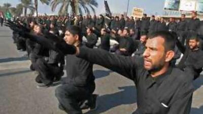 The Mahdi Army parades in Basra in 2005. Some of its soldiers say they received training from Hizbollah.