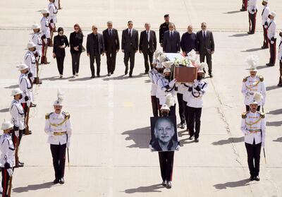 Iraq’s Prime Minister Mustafa Al Kadhimi and other officials walk behind the coffin of Iraqi poet Muthaffar Al Nawab after its arrival at Baghdad airport. Photo: Iraq PMO Twitter